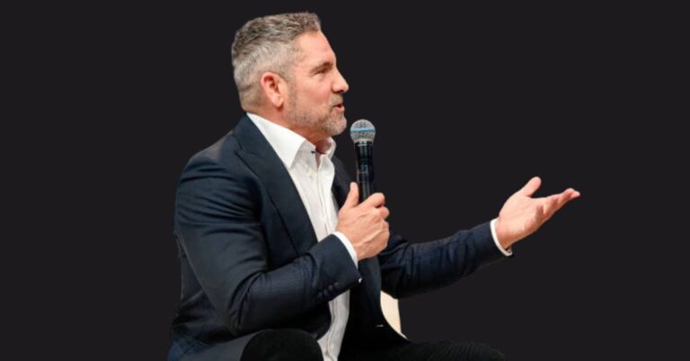 Grant Cardone posing confidently with a luxury real estate skyline in the background, symbolizing his $600M empire in 2025.