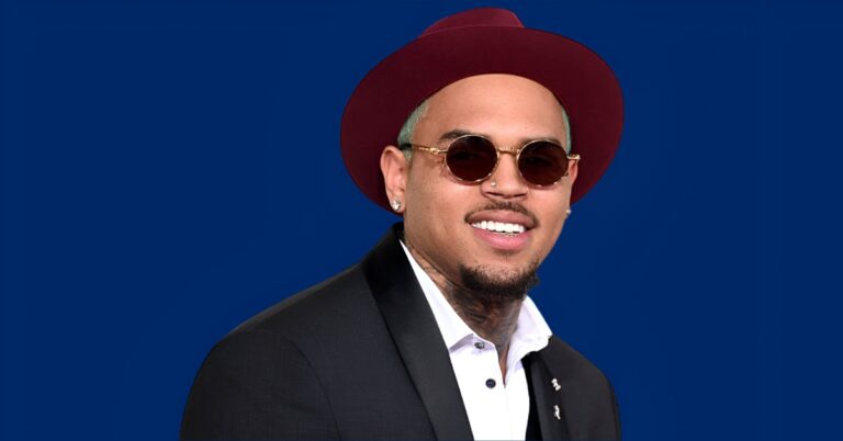Chris Brown in a stylish outfit, showcasing his success and $50 million net worth in 2025.