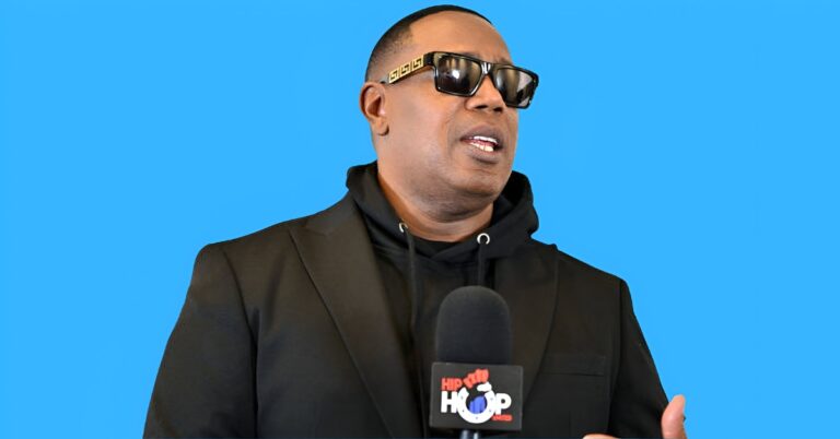 Master P posing with luxury cars and business assets, representing his $250M net worth in 2025.